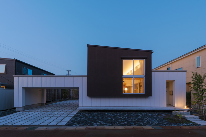 two contrasting volumes intersect in takeru shoji architects' house in kitanyuugura, japan