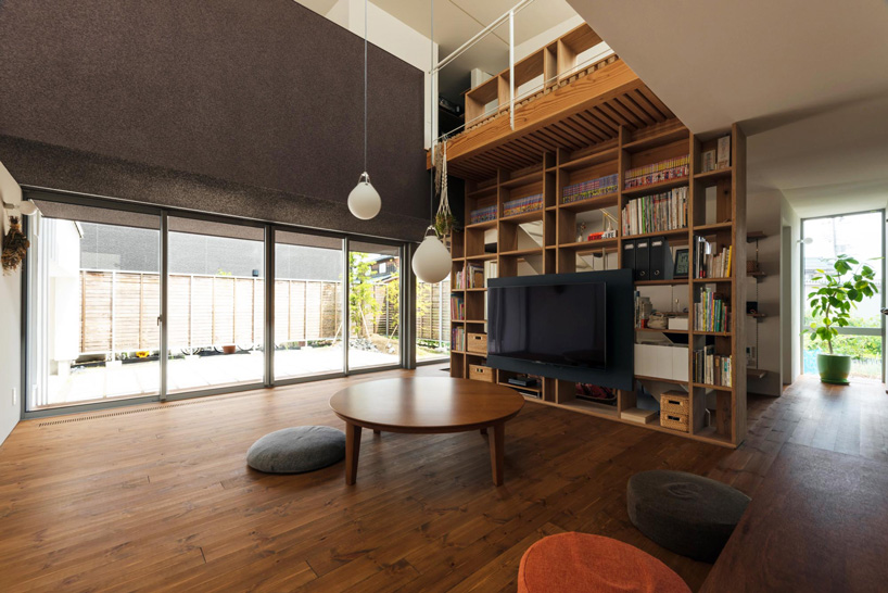 two contrasting volumes intersect in takeru shoji architects' house in kitanyuugura, japan