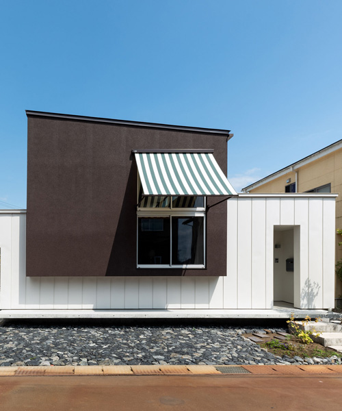 two contrasting volumes intersect in takeru shoji architects' house in kitanyuugura, japan