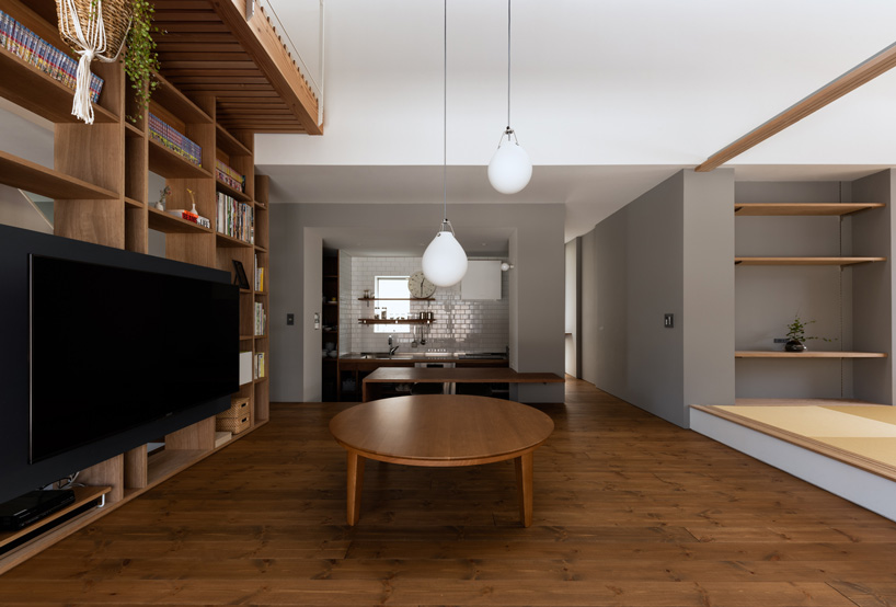 two contrasting volumes intersect in takeru shoji architects' house in kitanyuugura, japan