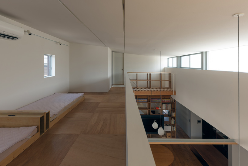 two contrasting volumes intersect in takeru shoji architects' house in kitanyuugura, japan