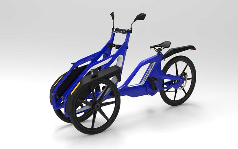 the companion bike lets wheelchair users ride in tandem