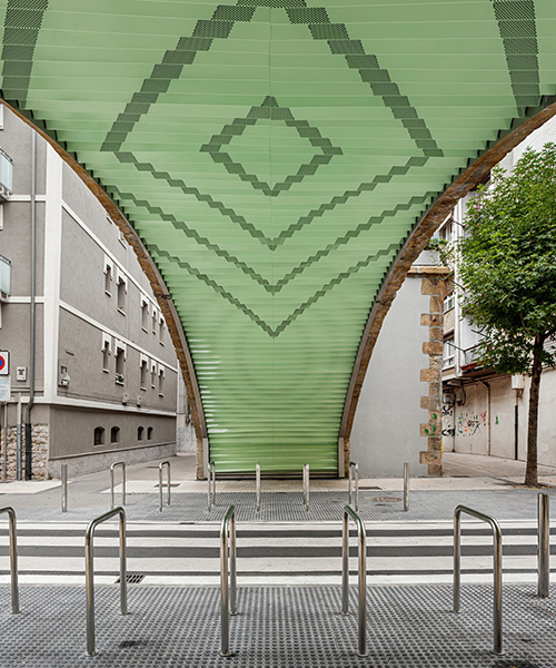 VAUMM reconditions railway arches with mint green colored-tiles in spain