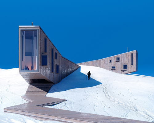 the winter hotel by davit and mary jilavyan emerges from snow-covered slopes