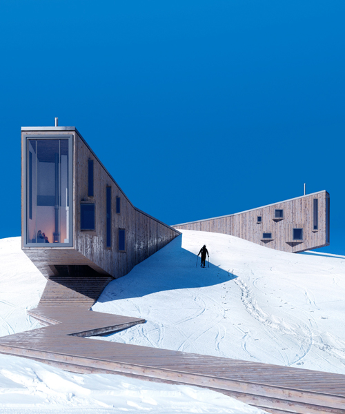the winter hotel by davit and mary jilavyan emerges from snow-covered slopes
