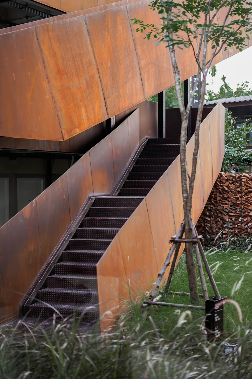 b l a n k s t u d i o encloses wonderwall hotel in thailand using wall of disarranged bricks