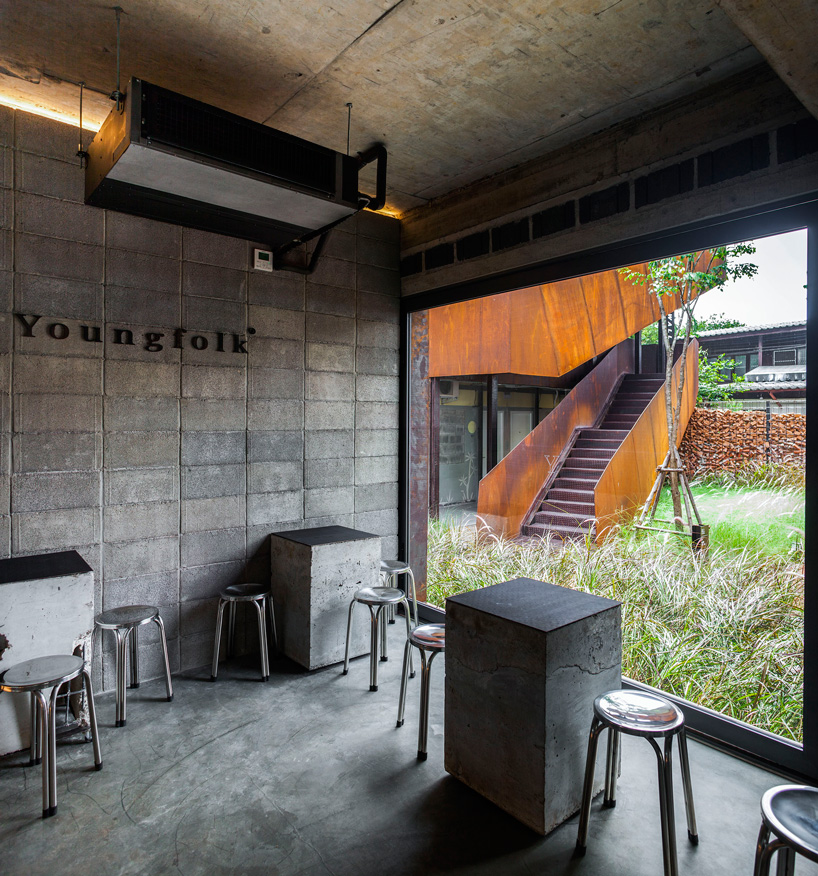 b l a n k s t u d i o encloses wonderwall hotel in thailand using wall of disarranged bricks