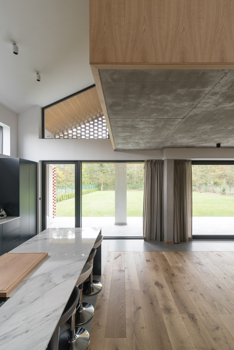 wrzeszcz architekci uses bricks from an old barn to build new house in poland