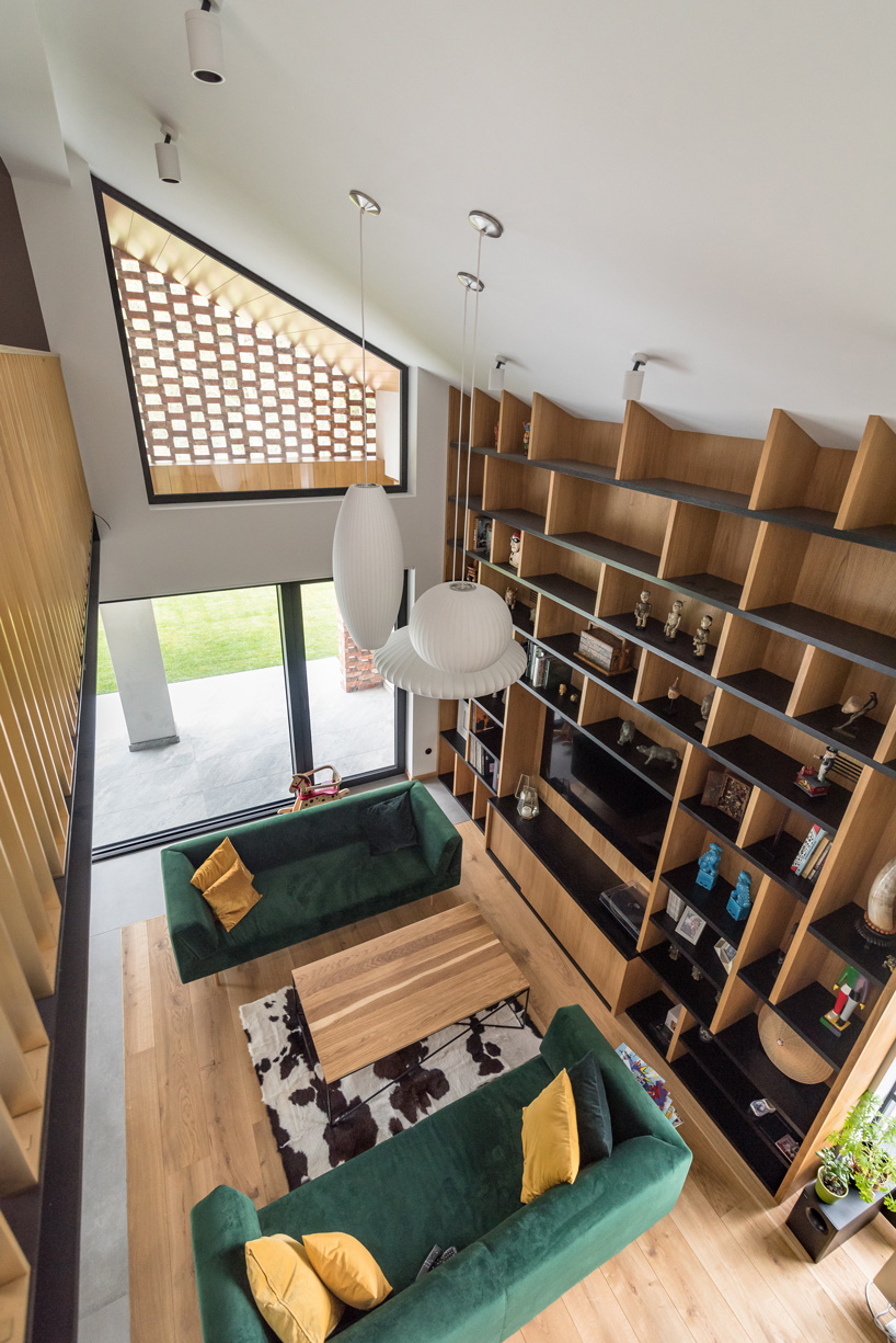 wrzeszcz architekci uses bricks from an old barn to build new house in poland