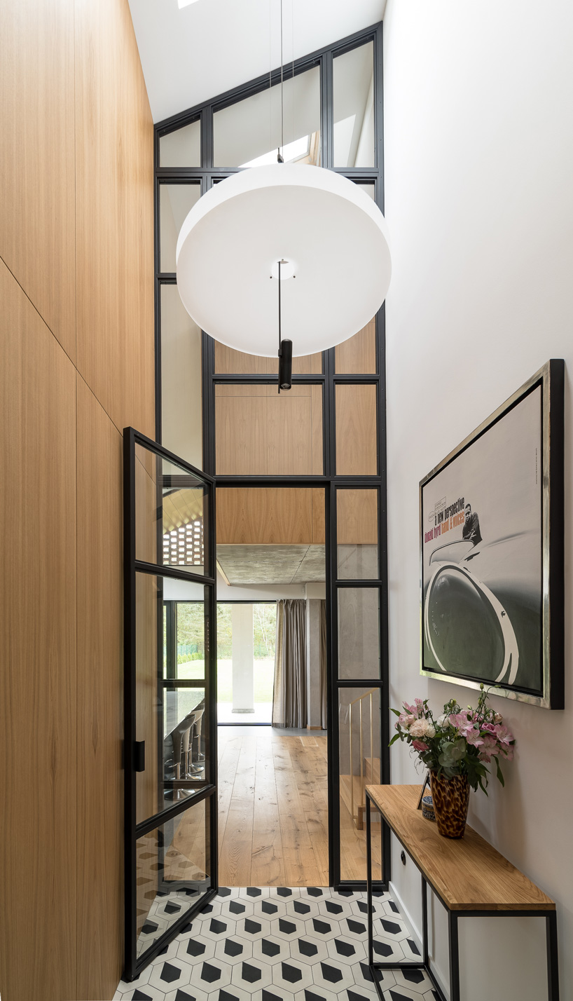 wrzeszcz architekci uses bricks from an old barn to build new house in poland