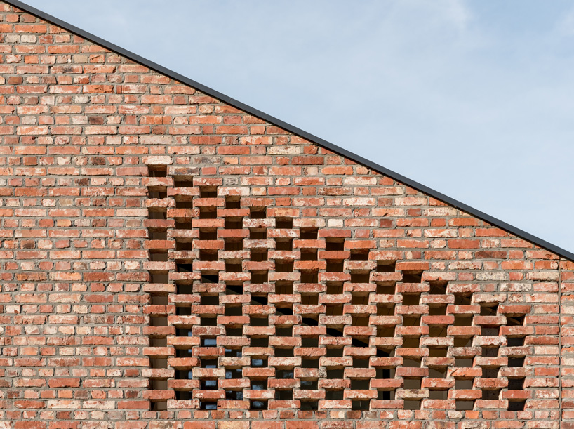 wrzeszcz architekci uses bricks from an old barn to build new house in poland