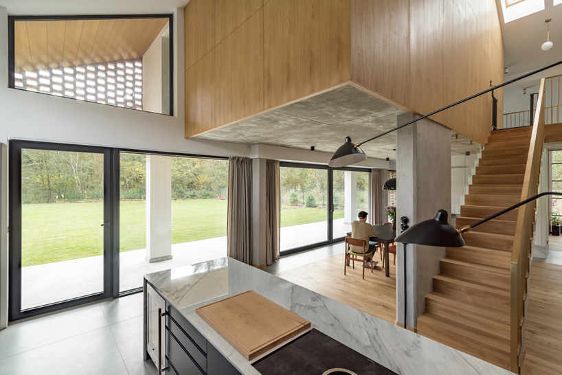 wrzeszcz architekci uses bricks from an old barn to build new house in poland