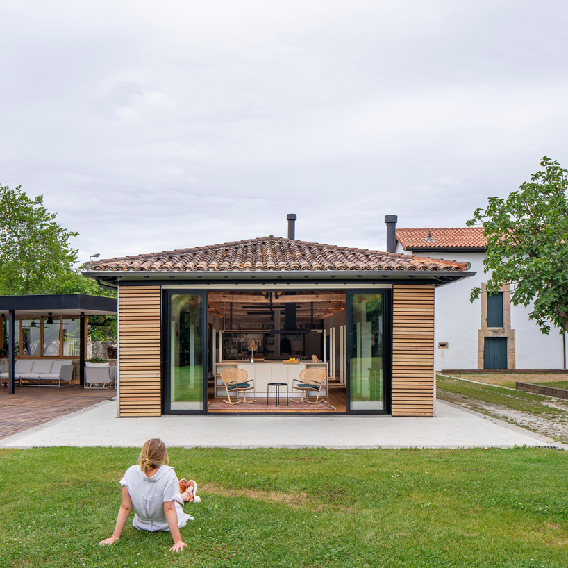 zooco estudio converts former stable into seasonal house in güemes, spain