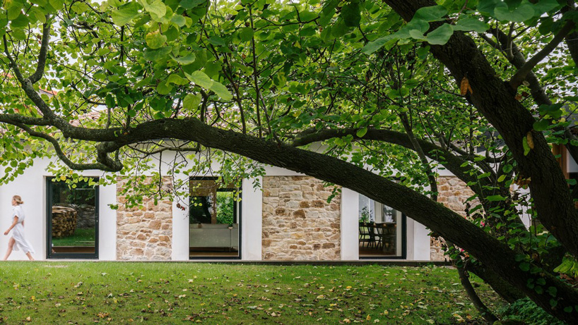 zooco estudio converts former stable into seasonal house in güemes, spain