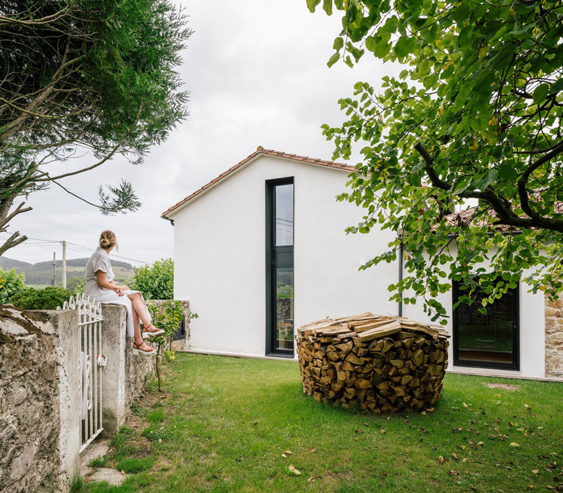 zooco estudio converts former stable into seasonal house in güemes, spain