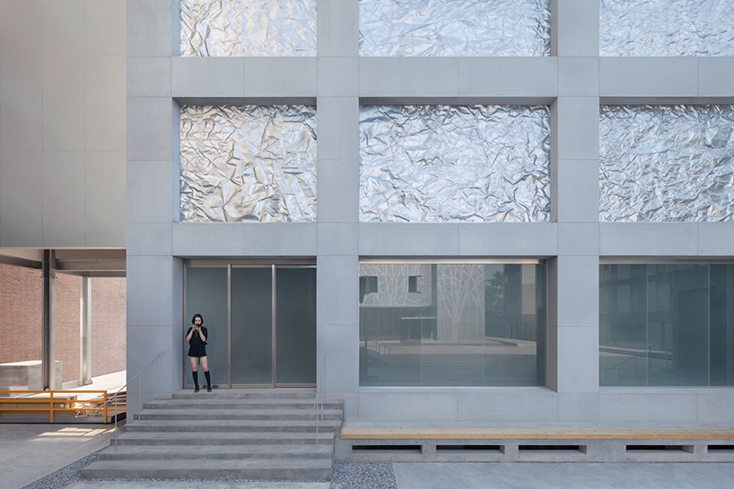 M WOODS hutong in beijing features façade of folded galvanized steel sheets