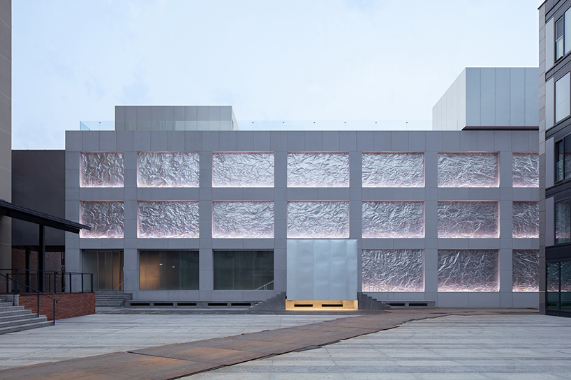 M WOODS hutong in beijing features façade of folded galvanized steel sheets