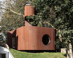 corten steel wraps a sculptural guesthouse in belgium designed by atelier vens vanbelle