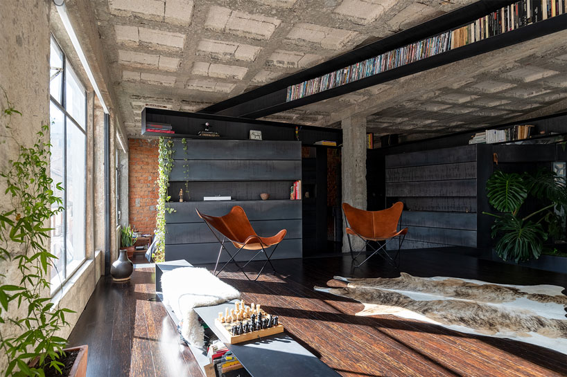 exposed concrete columns furnish aquiles jarrín's 'forest' apartment renovation in quito designboom