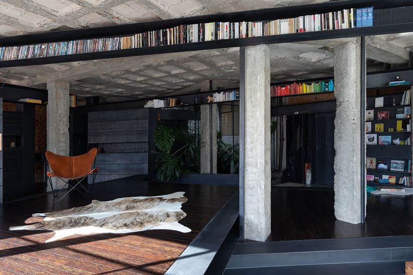 exposed concrete columns furnish aquiles jarrín's 'forest' apartment renovation in quito designboom