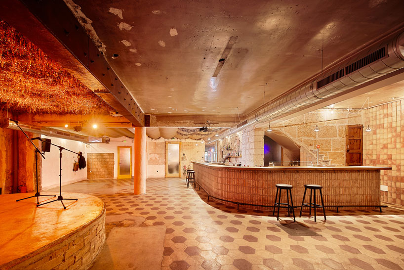 aulets arquitectes + carles oliver weave a new music venue into an old café in mallorca designboom