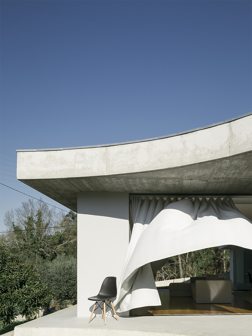 bruno dias arquitectura tops residence in portugal with organic shaped  concrete slabs