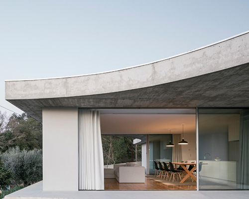 bruno dias arquitectura tops residence in portugal with organic shaped concrete slabs