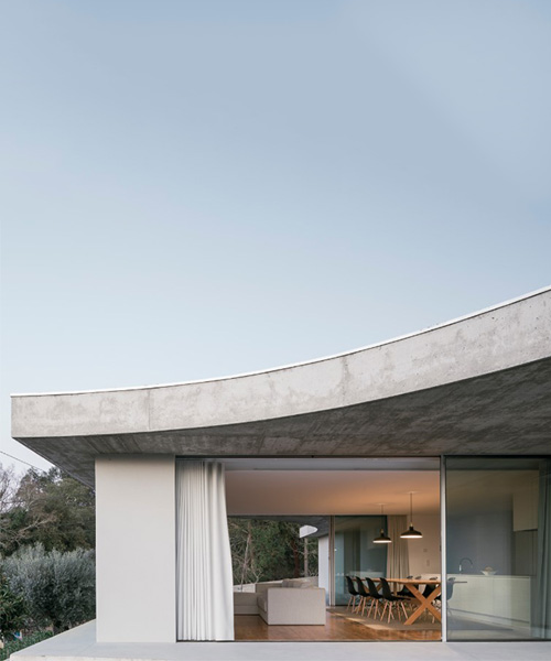 bruno dias arquitectura tops residence in portugal with organic shaped concrete slabs