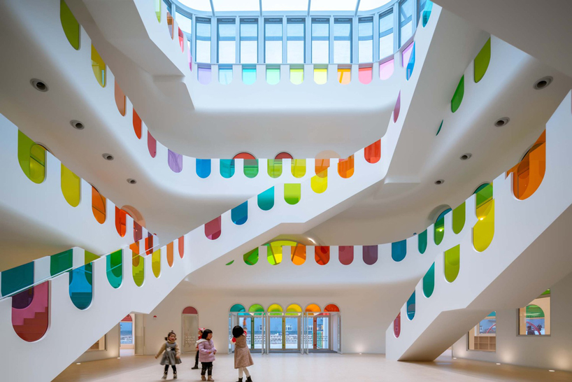 colorful glass decorates this kaleidoscopic kindergarten in china by SAKO architects