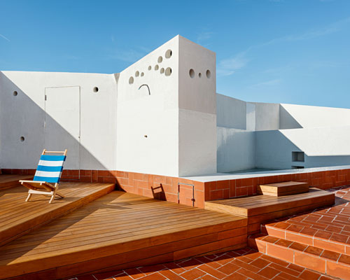 daw office restores an 18th century building with a community rooftop in barcelona
