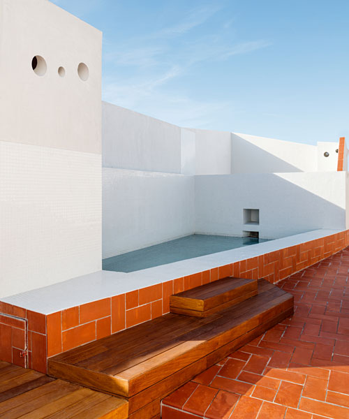 daw office restores an 18th century building with a community rooftop in barcelona