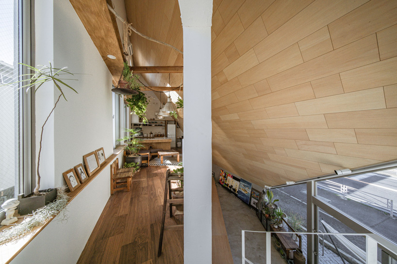 DOG completes 8.5 house in japan with steep sloping roof and diagonal exhibition wall