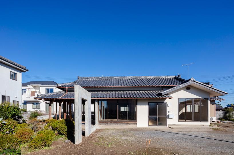 DOG scales down house topped with traditional tile roof in kawagoe, japan