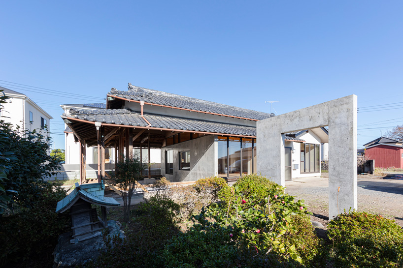 DOG scales down house topped with traditional tile roof in kawagoe, japan