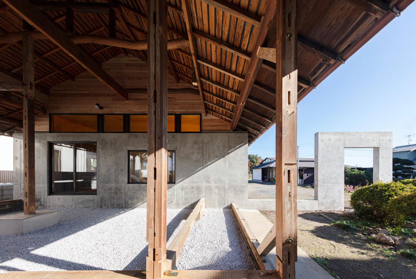 DOG scales down house topped with traditional tile roof in kawagoe, japan