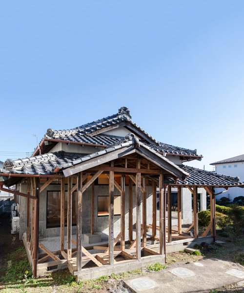 DOG scales down house topped with traditional tile roof in kawagoe, japan