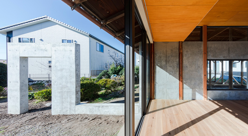 DOG scales down house topped with traditional tile roof in kawagoe, japan