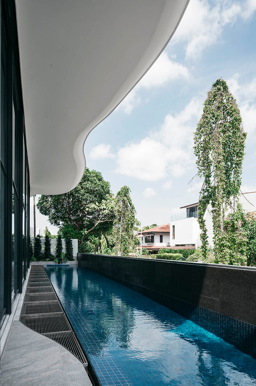 curved geometries define EHKA studio's sculptural 'jalan seaview' house in singapore