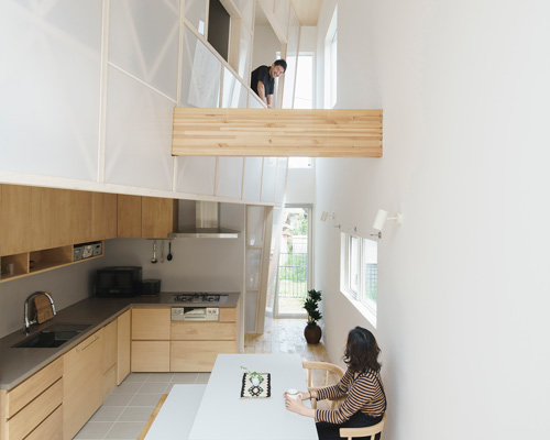 eri sumitomo architects + enjoyworks insert acrylic 'curtain' within house in hayama, japan