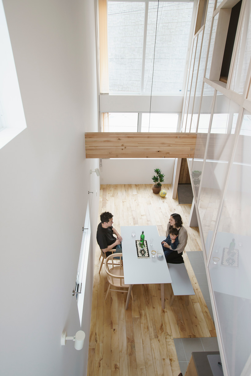 eri sumitomo architects + enjoyworks insert acrylic 'curtain' within house in hayama, japan