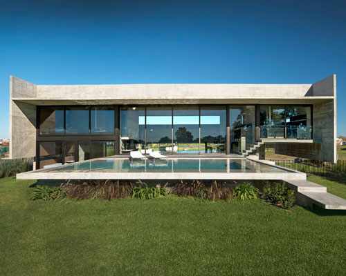 horizontal concrete planes articulate the escobar house by luciano kruk in argentina