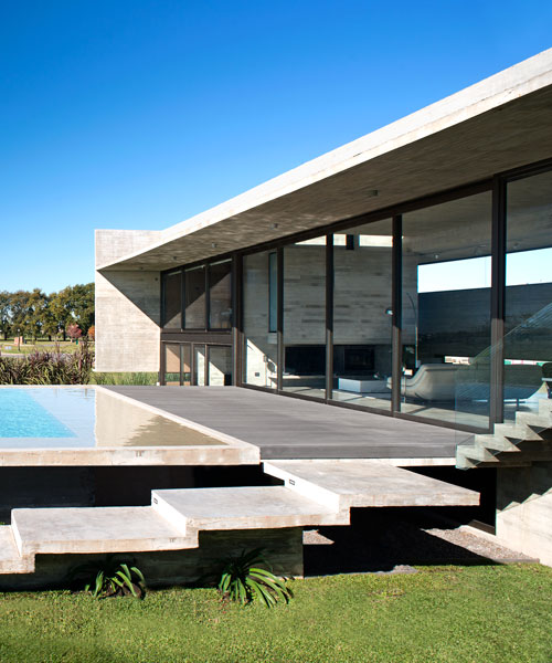 horizontal concrete planes articulate the escobar house by luciano kruk in argentina