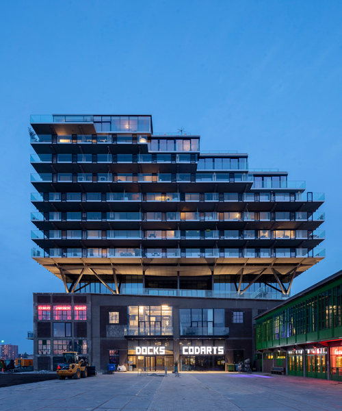 fenix I by mei architects floats atop heritage warehouse on the rotterdam waterfront