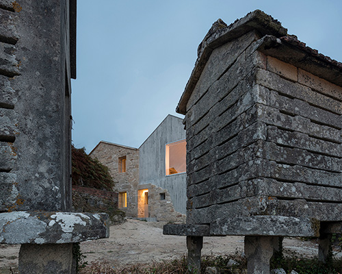 fuertespenedo arquitectos adds concrete volume to traditional stone house in spain