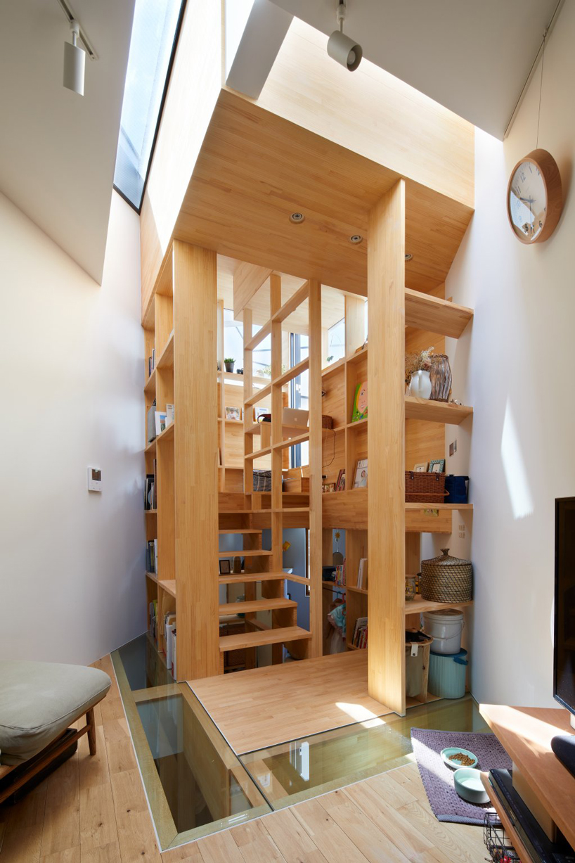 fujiwaramuro architects' narrow house in tezukayama, japan, is built around a 'shelf-staircase'