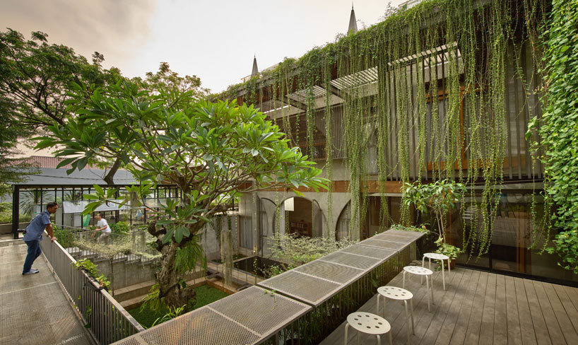 lush greenery envelops RAW architecture's multi-purpose complex in indonesia