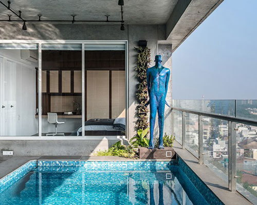 harsh boghani exposes raw materials and adds bold sculpture to apartment in india