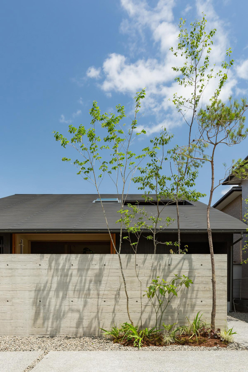 gabled roof with extended eaves tops hearth architects' hikone house in japan