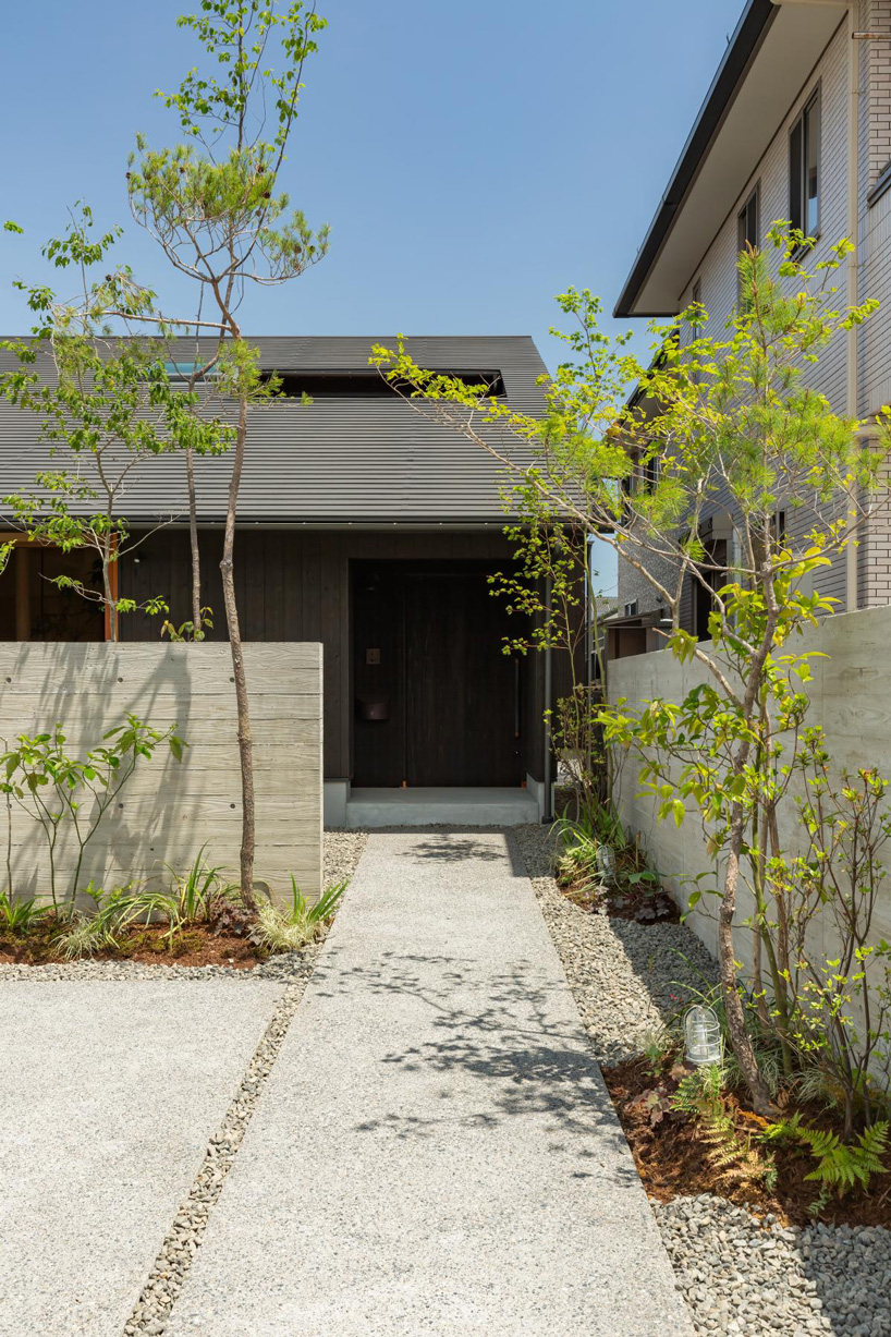 gabled roof with extended eaves tops hearth architects' hikone house in japan