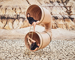 henry baumann turns wooden drums into croissant-like listening sculptures